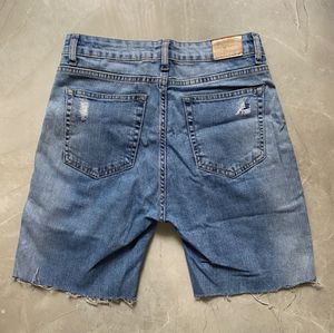 RIPPED BERMUDA SHORTS