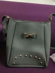 grey sling bag