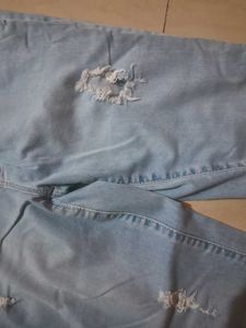 Distressed Light Wash Denim Jeans