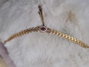Gold Tone Hand Chain with Ruby