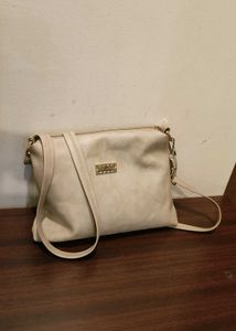 cream colour sling bag
