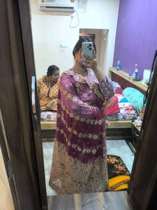 Purple Net Heavy Work Saree With Shiny Petticoat.