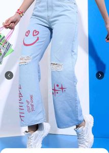 Ripped Jeans with Graffiti