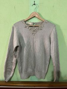 silver sweater with pearl and beaded embellishment