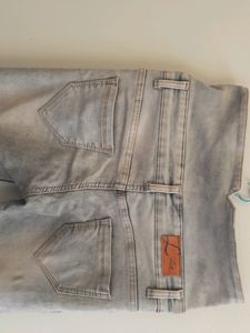 High-Waisted Button Jeans