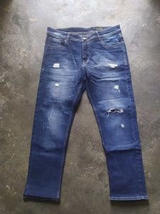Ripped Blue Denim Jeans