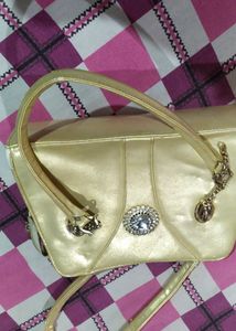 A Used Gold Colour Purse Ok In Condition