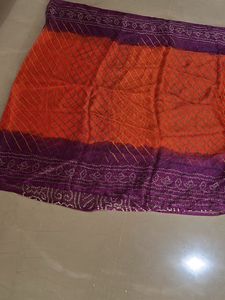 Lovely orange and purple bandhej Saree