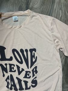 Love Never Fails Graphic Tee