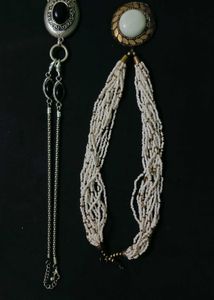A Black Necklace along With White One