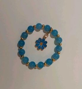 Blue Beaded Bracelet with Daisy Charm