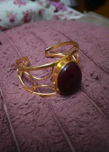 Gold Tone Cuff Bracelet with Maroon Stone