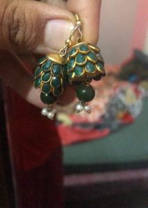 Green earrings Have Some Signs Of Wear And Tear