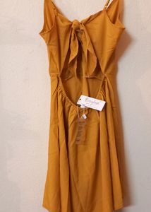 Today&#39;s Offer ₹150 Berrylush Women Solid Yellow Front Twist Knot Fit &amp; Flare Mini Dress For Women (Mustard Colour)