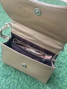 Elegant Clutch with Peacock Detail