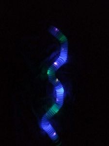 light-up pop tube, a sensory and fidget toy.