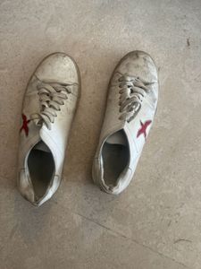 Worn White Sneakers