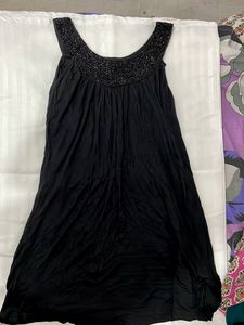 Black Party Wear Top With Shimmery Neckline