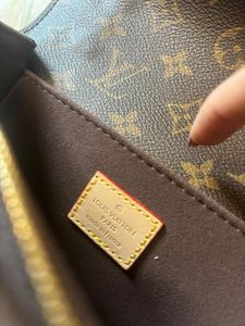 Authentic  Louis Vuitton  Metis East West