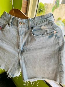 H&amp;M light blue washed ripped shorts