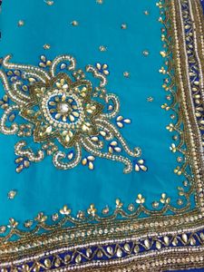 party wear saree firozi colour saree & dark blue border with beautifu work as per showing in pic full length saree blouse size mention in pic