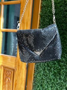 Black metal mesh sling bag