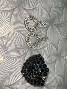 Diamond earrings with black beaded bracelet