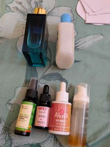 6 Empty bottles of perfumes and serum