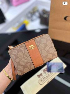 Coach Wristlet- Any 1