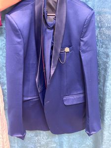It Is a Blazer With Waist Coat And Tie
