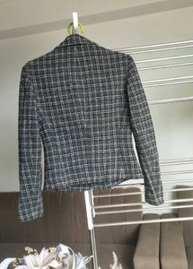 Black striped long sleeve blazer.