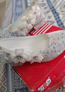 White Cinderela Shoes.