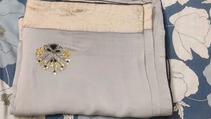 Grey saree with gold border