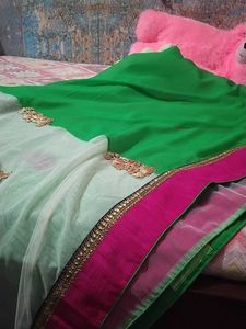 Saree half green and white combination.
