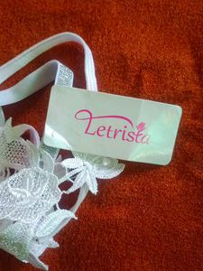 Unisex Lacy White Thong with Charm
