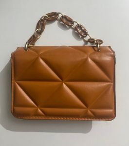 Quilted Orange Sling Bag With A Chain
