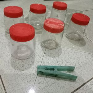 6 small size glass containers.