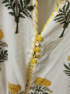 White Kurti with flower design. Can Be worn as shrug also. Length - 46in.