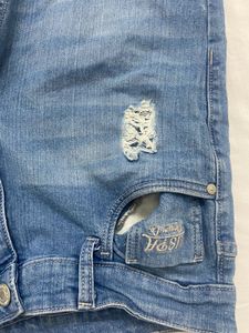 Light blue denim jeans with a cool distressed look