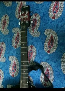 YEMAHA Guitar with Pick Holder And Bag.