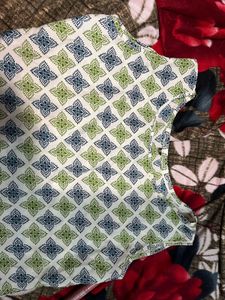 both Patterned Sleeveless Top and long kurti