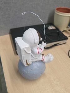 Astronaut Fishing on the Moon Figurine
