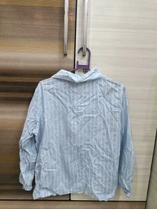 blue shirt with white stripes