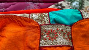 Orange Saree With Turquoise And GoldenBorder