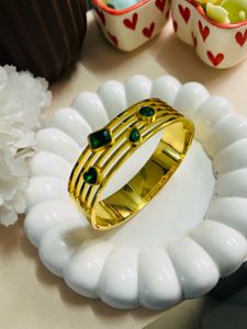 Gold Tone Bangle with Green Accents