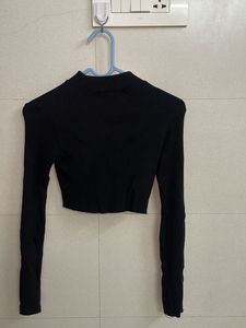 Cropped ribbed turtleneck top