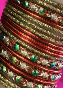 Orange And Golden Colour Bangles