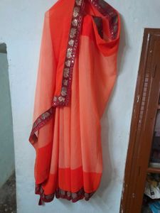 Classicate Orange Embroidered Chiffon Saree