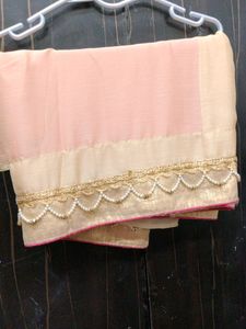 It's a Combination Of Pink And Cream Colour Saree