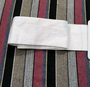 This is a very beautiful white colored cloth belt